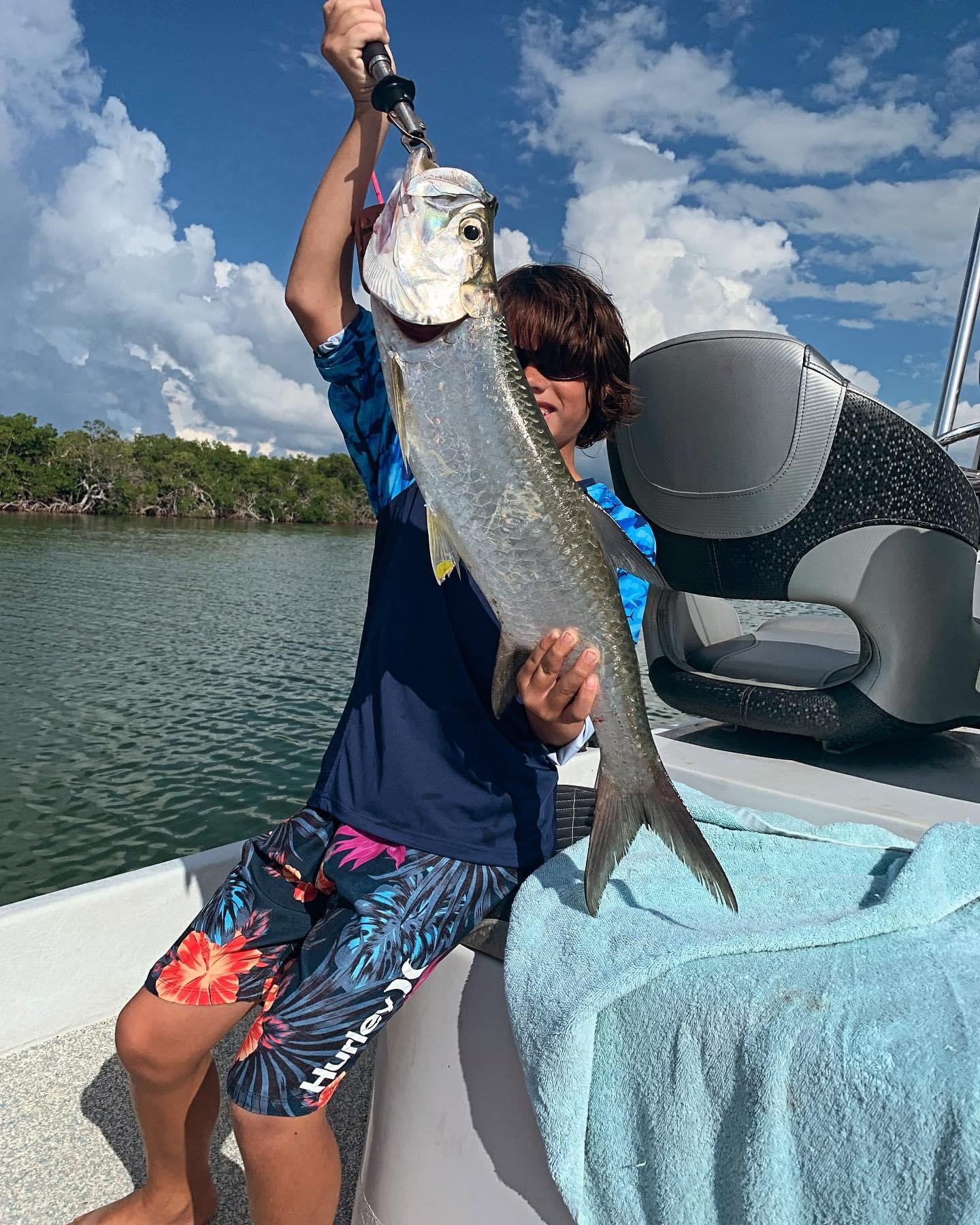 Holding up fish caught on 4-hour trip