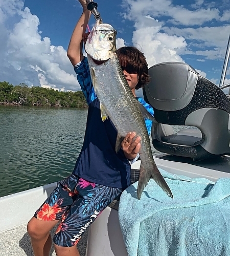 Holding up fish caught on 4-hour trip
